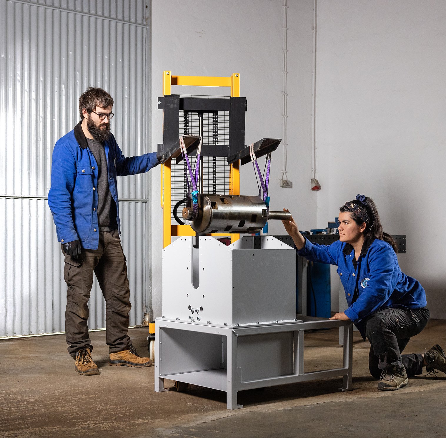 Yann and Caro assembling one of their Shredder Pro machines.