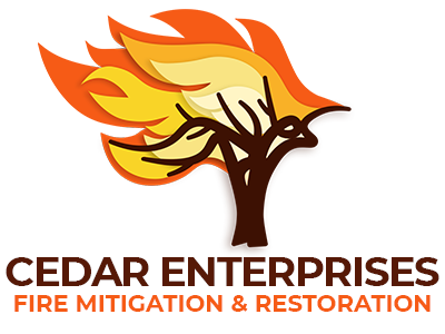 Logo of Cedar Enterprises features a stylized tree with flames in orange and yellow colors, accompanied by the text 'CEDAR ENTERPRISES' and 'FIRE MITIGATION & RESTORATION'.
