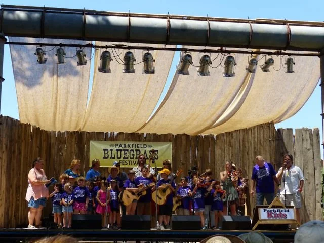Children and adults perform on the main stage during the Parkfield Bluegrass Festival Kids on Bluegrass Performance