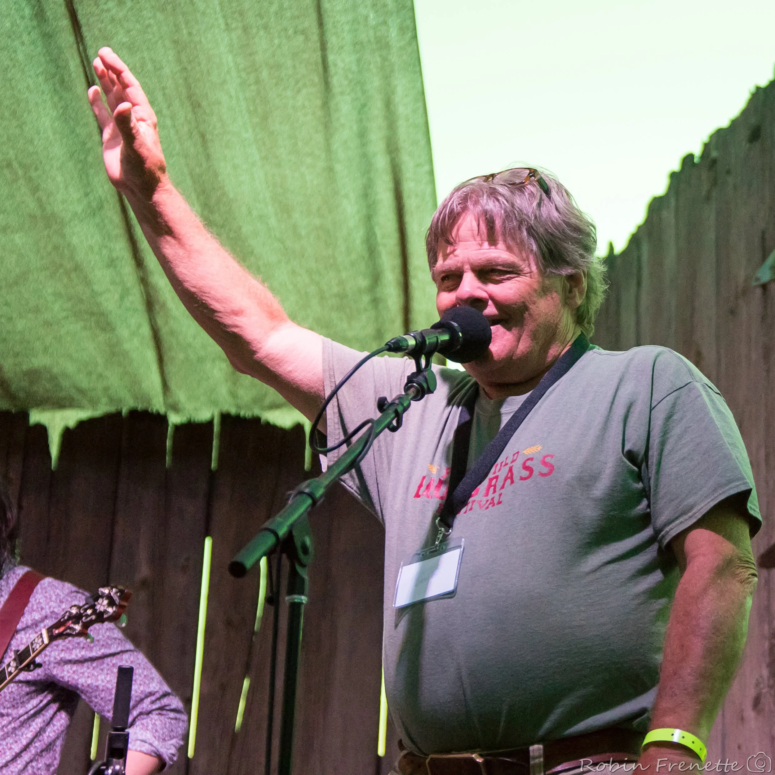 President Dave Swartz MCing at the Parkfield Bluegrass Festival.
