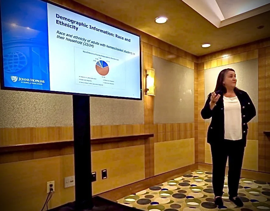 Angela R. Watson speaking at an event.