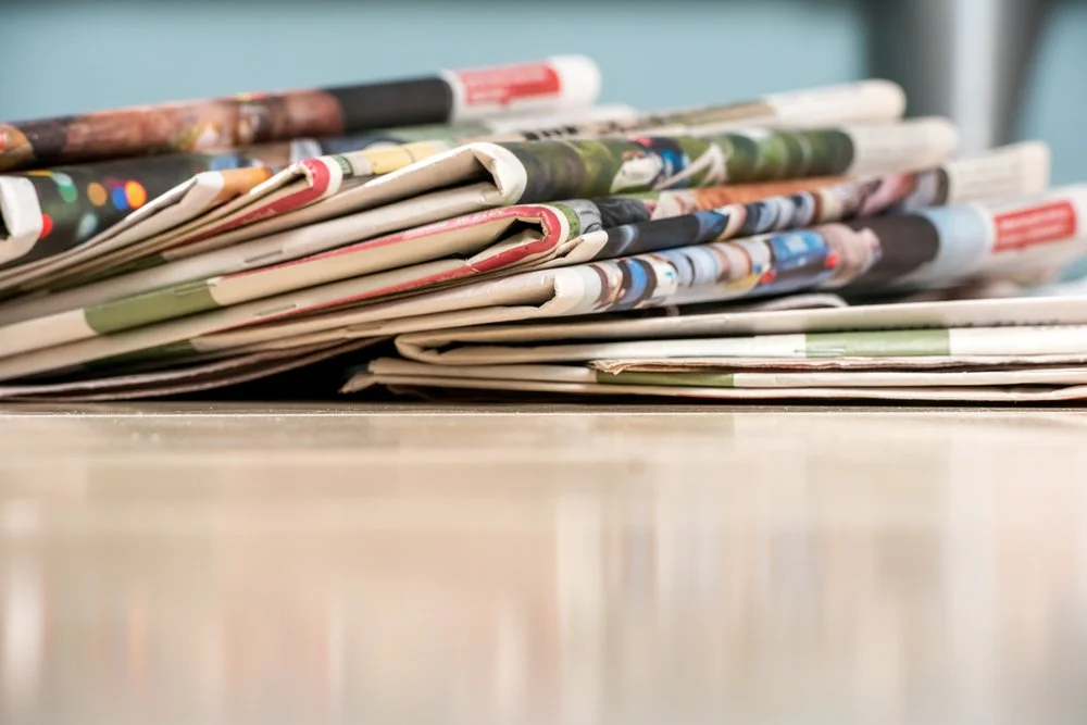 A stack of newspapers.