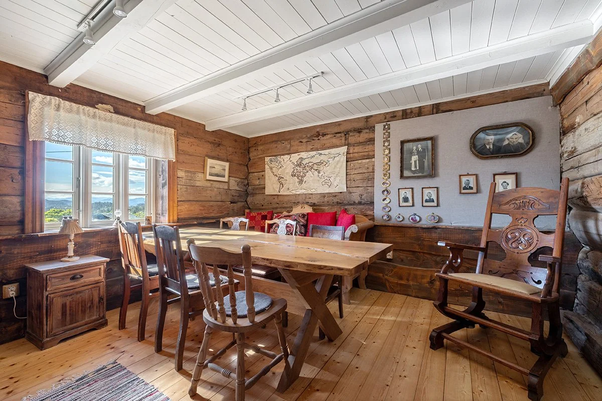 One out of two living rooms. This room is the oldest room in the house, dating back to the 17th Century. The main table is made out of local oak wood.