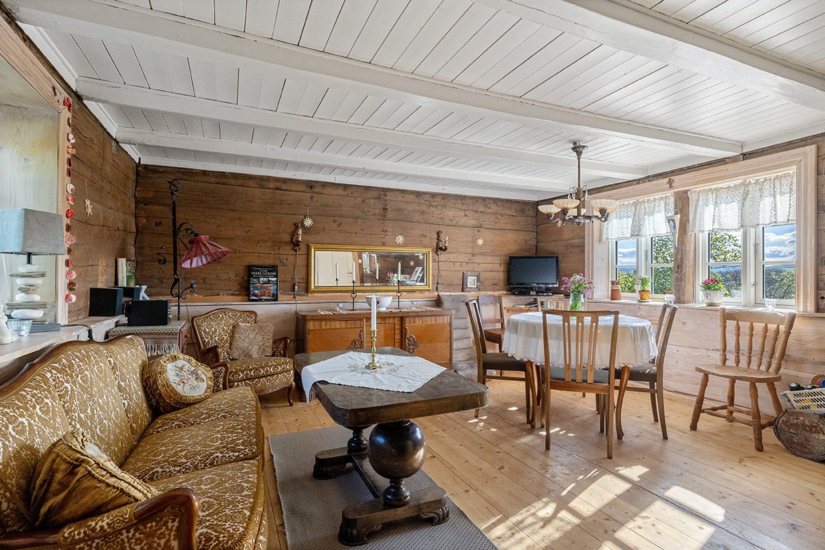 The main living room, with a dining table and a sofa.