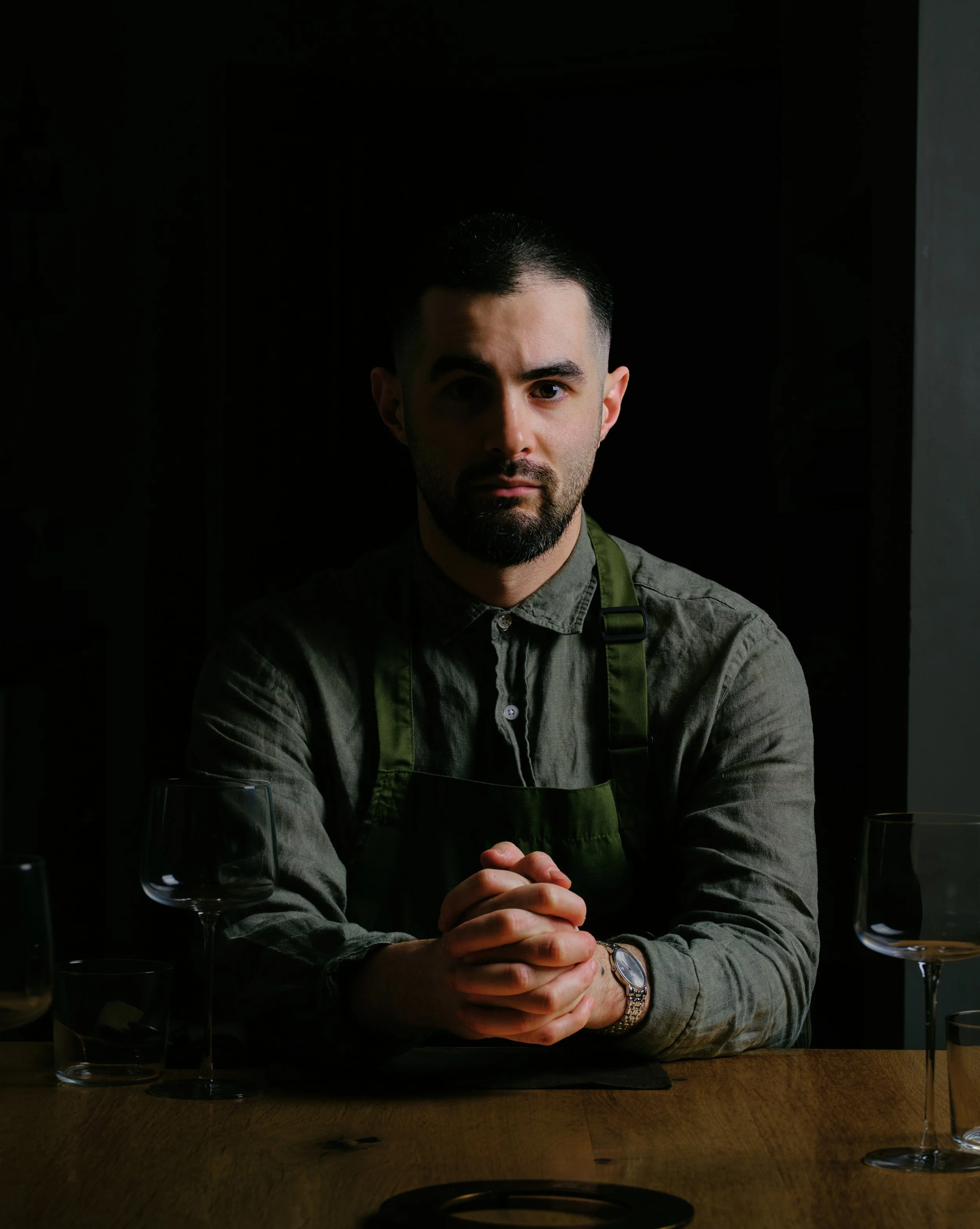 A chef staring down the camera lens