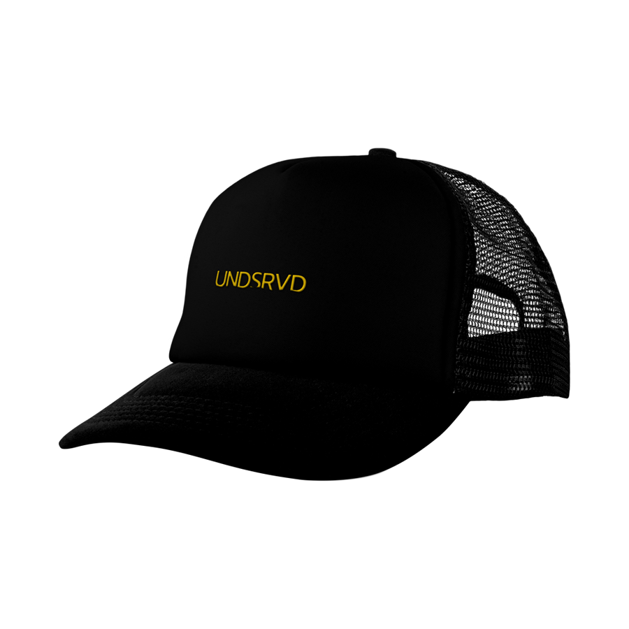 Black trucker hat with yellow embroidered text "UNDSRVD" on the front and adjustable mesh back.