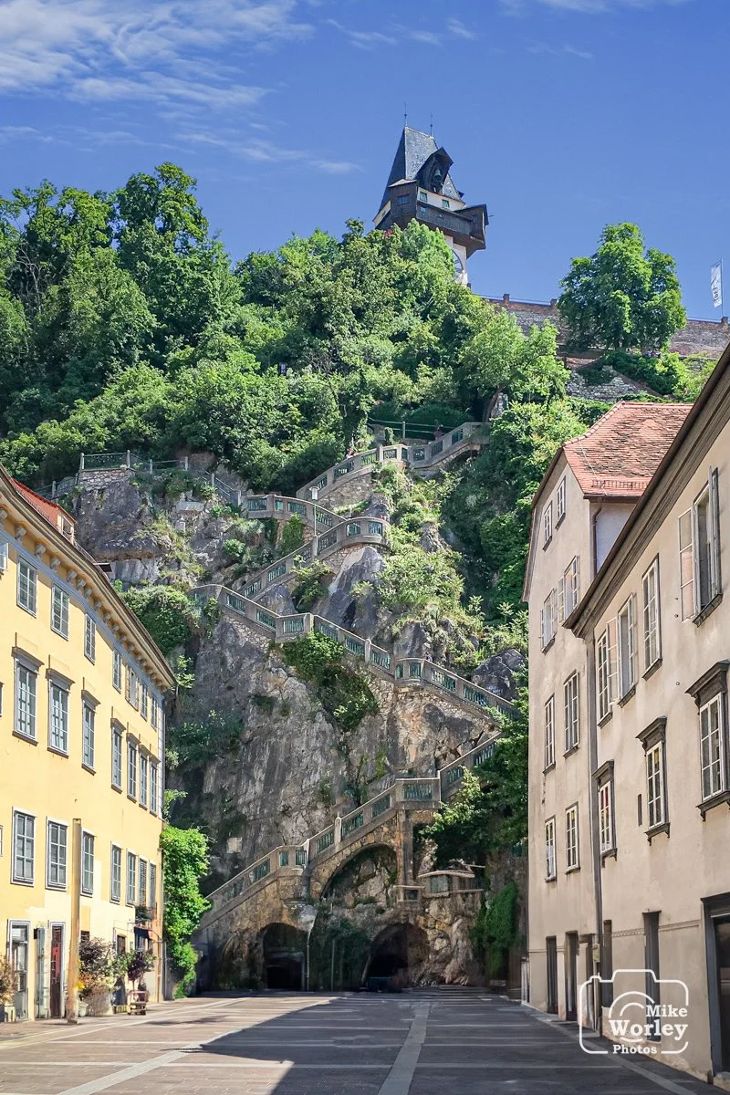 The Schloßberg, a tree-clad hill and site of a fortress, in the center of the city of Graz, Austria. The fortress, originally constructed in the 10th century, was never defeated. However, it was largely demolished by Napoleon under the Treaty of Schö