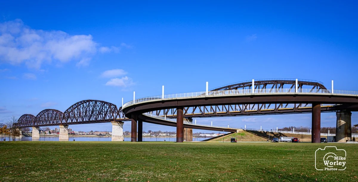 The Big Four bridge with its circular access ramp. The former railroad bridge has been converted to a pedestrian / bicycle path between Louisville and southern Indiana