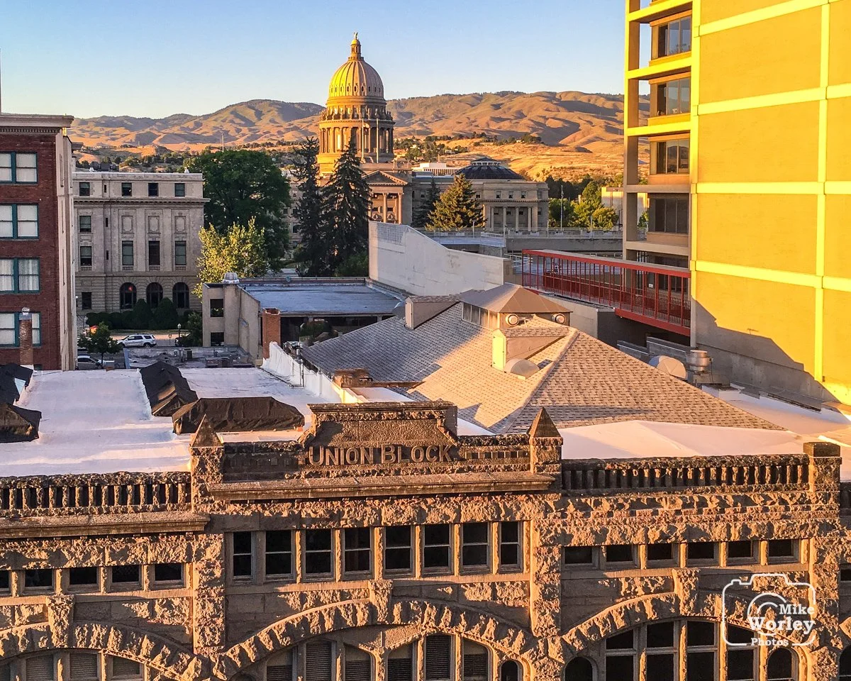 Downtown Boise, Idaho at sunset with views of the 1902 Union Block building and the 1905 state capitol.