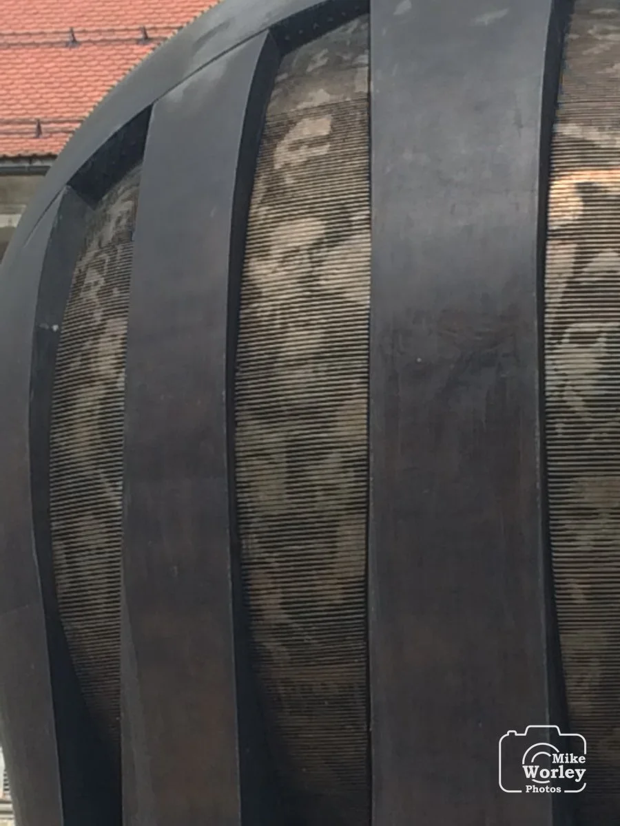 A monument in the town square of Maribor, Slovenia, honors 556 Slovenian partisans killed by Nazi troops during World War II. Faces of the partisans are visible on the monument.