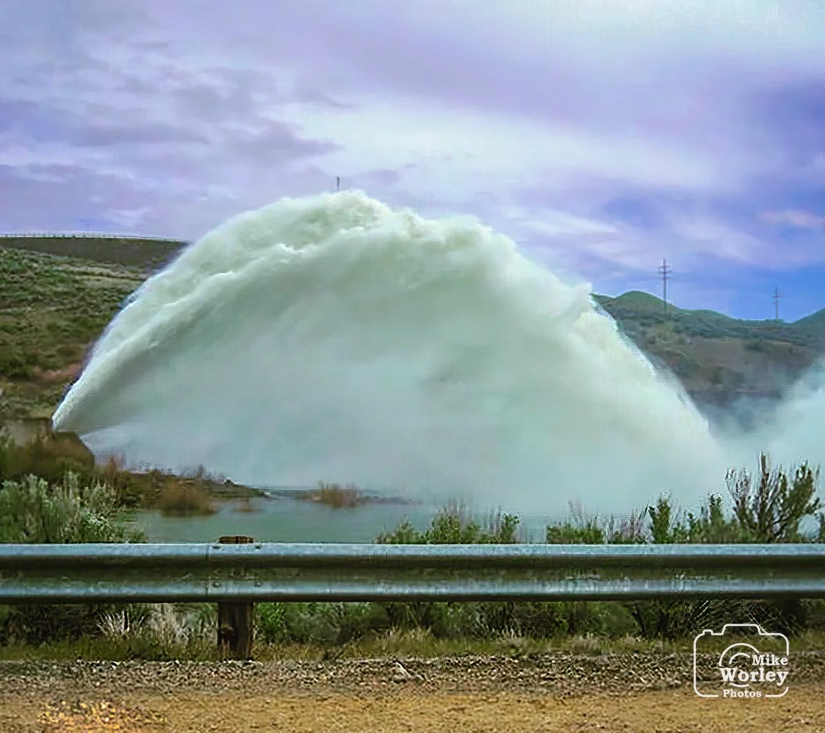 The water discharge spout from Lucky Peak dam northeast of Boise. The flood control earthen dam is visible behind the spout.