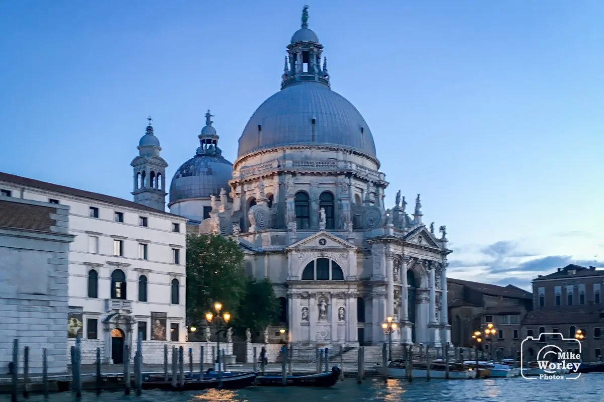 Re-entering the Grand Canal in Venice at dusk on returning from Burano Island. We were greeted by the Basilica di Santa Maria della Salute on Punta della Dogana. The Basilica was begun in 1631 in response to the devastating losses - at least 46,000 a