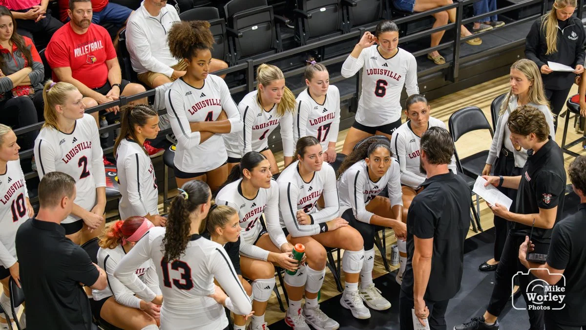 Coach Dan Meske addresses the team during a time out