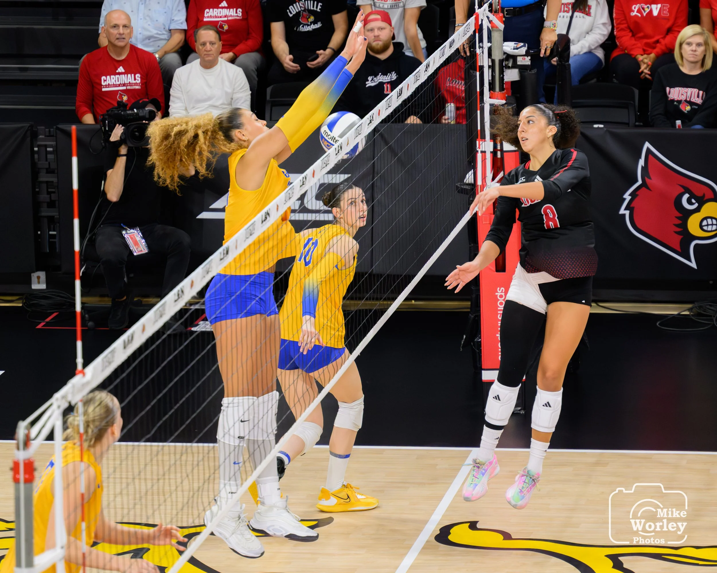 The dumped ball falls inside the block attempt