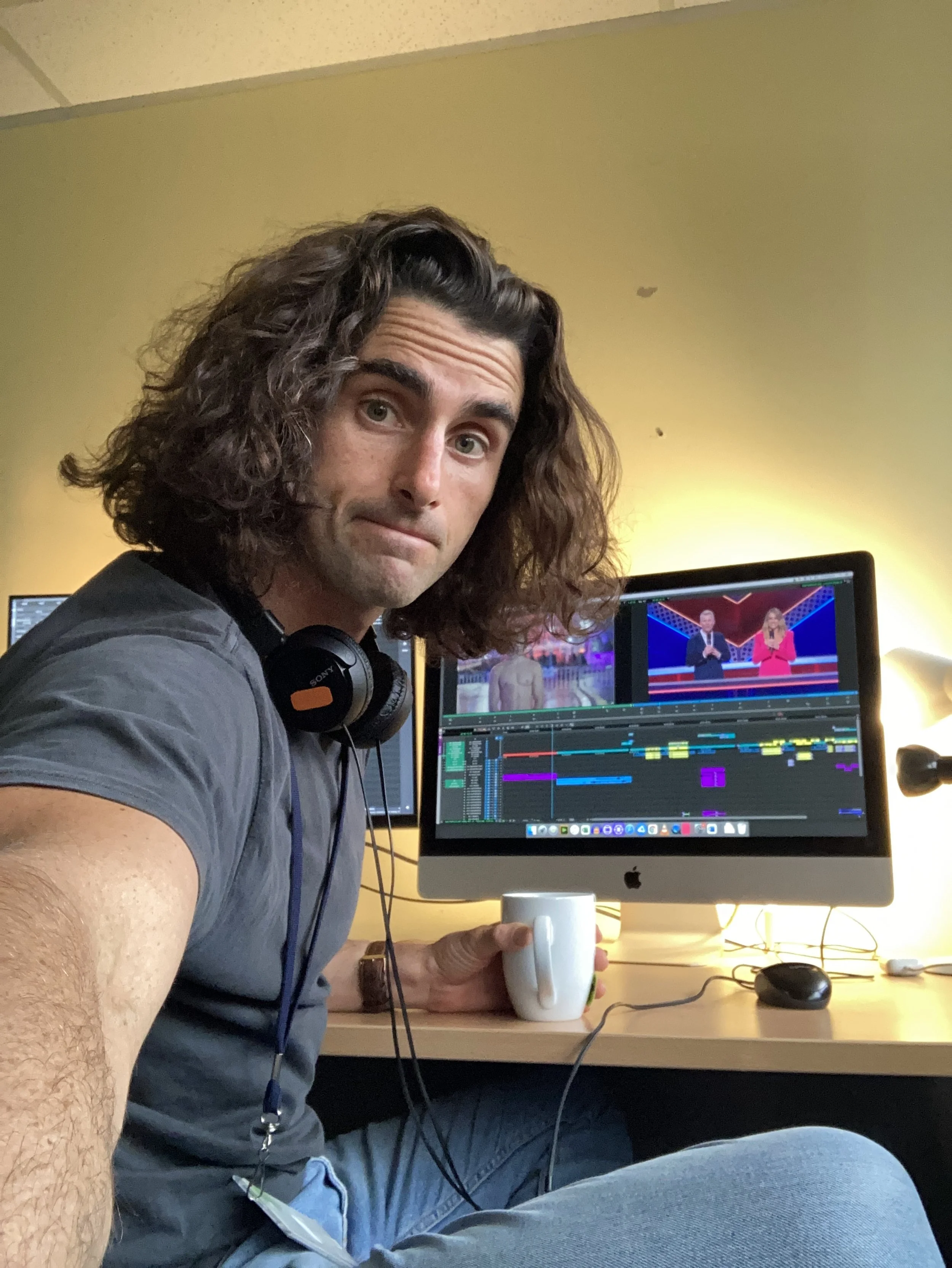 A gnarly dude bashing out an edit on Premiere Pro.