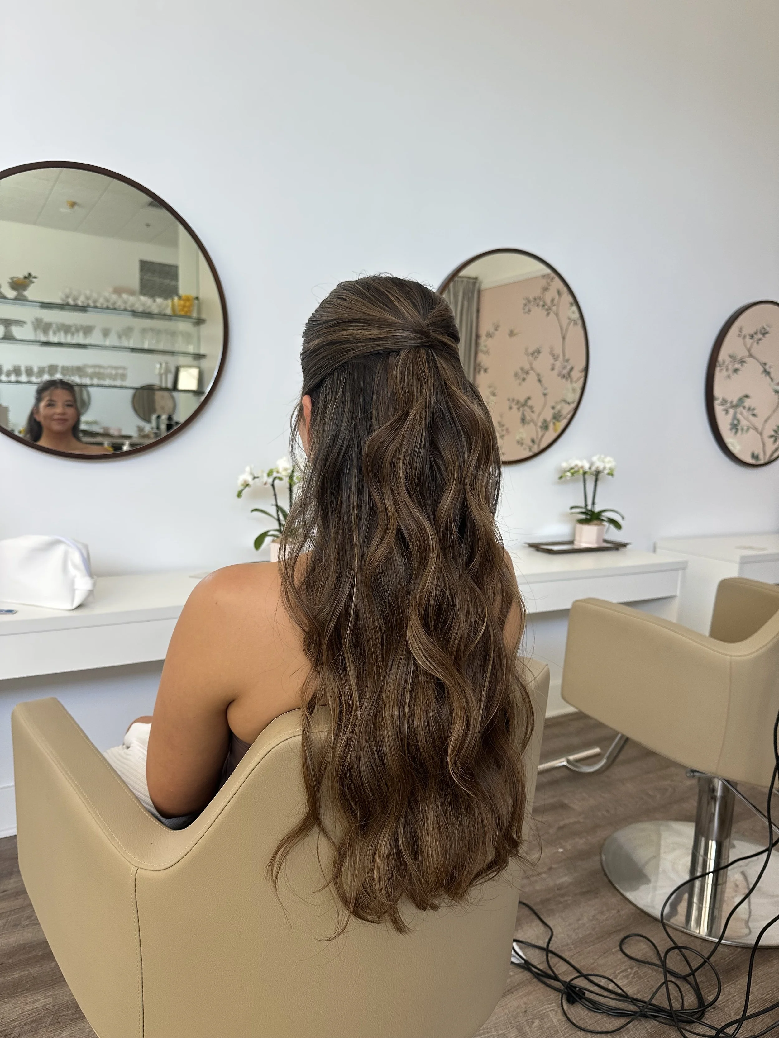 Bride with brunette half-up hairstyle and soft waves