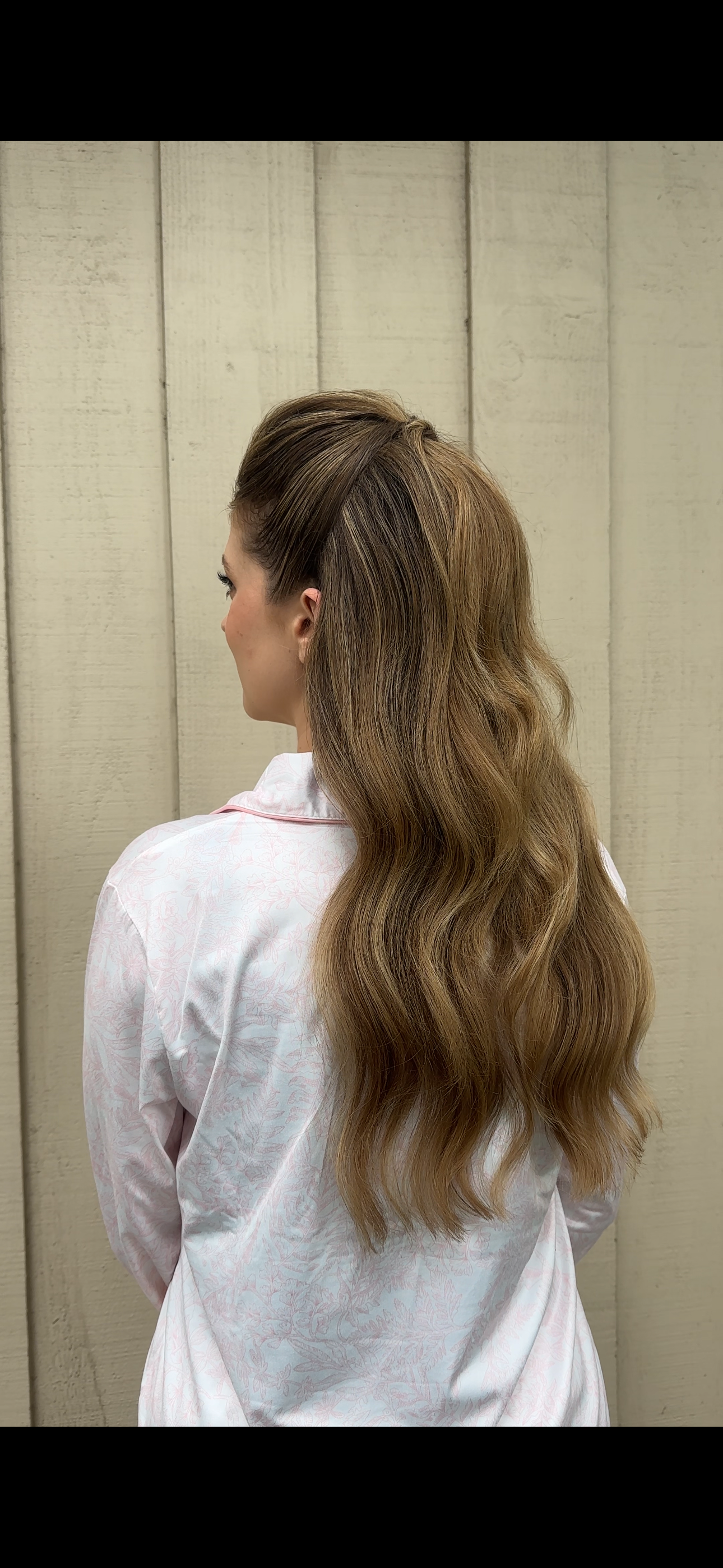 Bride with textured blonde half-up hairstyle and loose waves