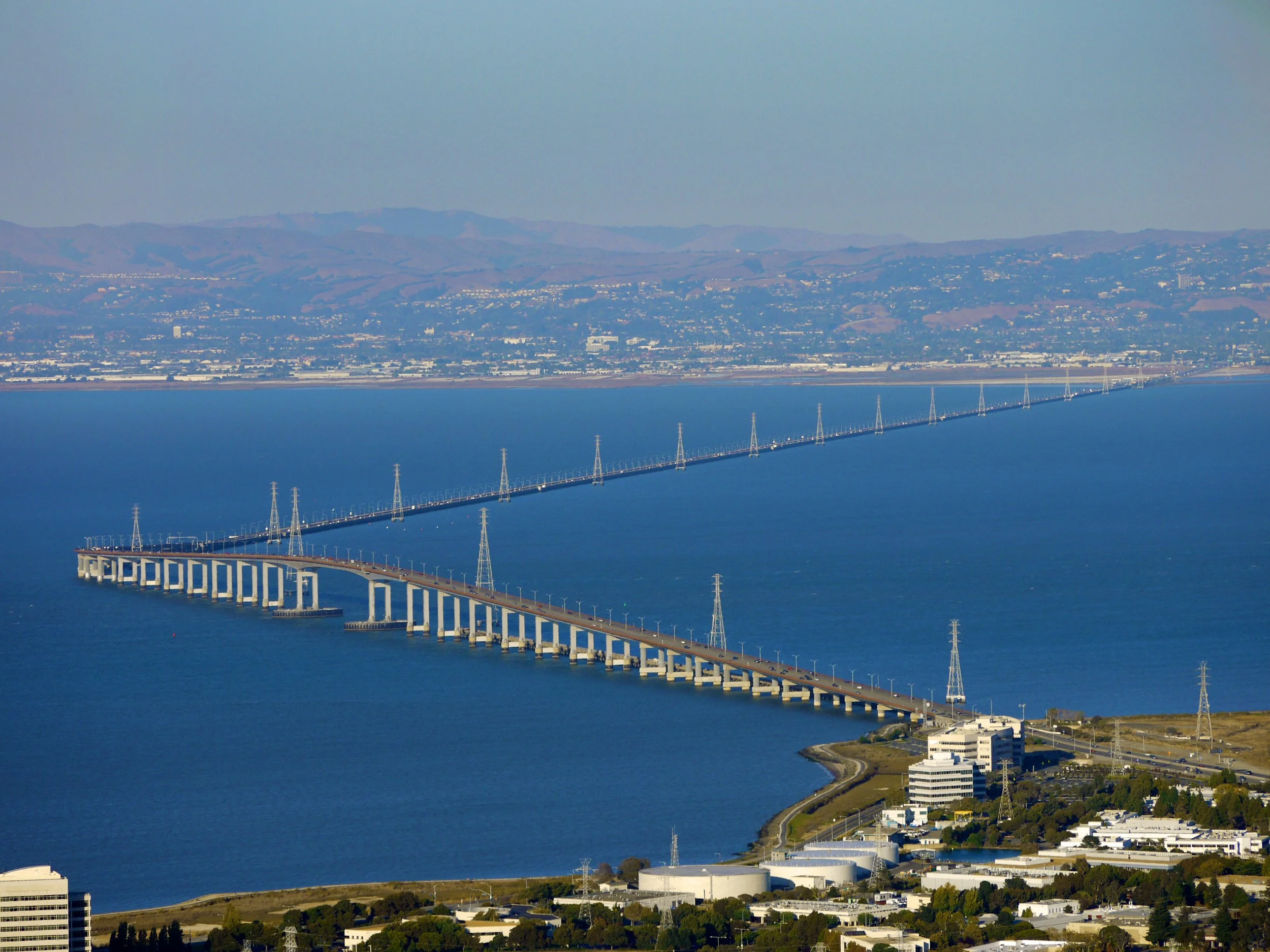 San Mateo–Hayward Bridge with San Mateo city skyline near mobile car detailing service area