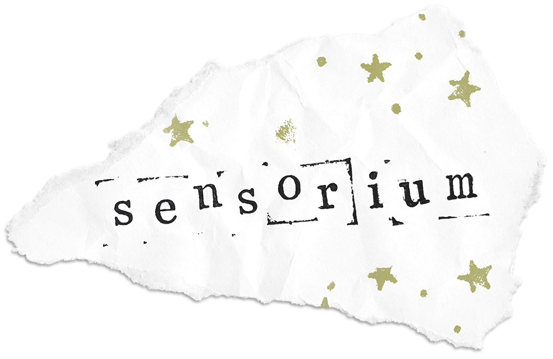 A torn piece of paper with the word 'sensorium' printed on it, surrounded by gold star illustrations.