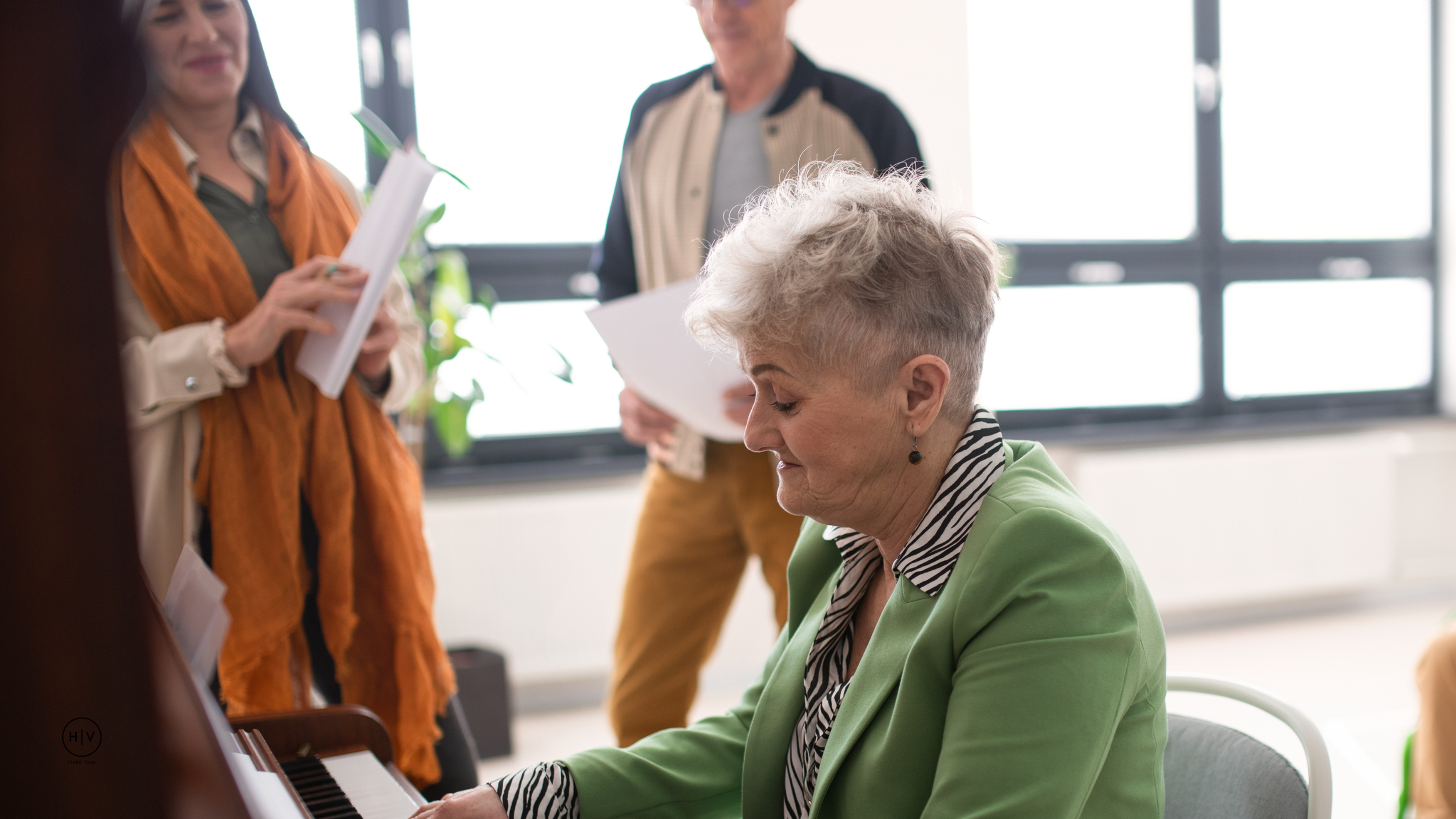 Older woman singing while playing the piano.