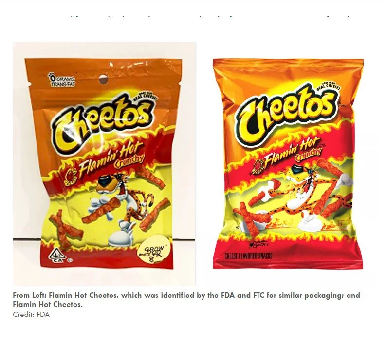 Two bags of Cheetos Flamin' Hot crunchy cheese snacks, one with crumpled packaging on the left and the other with intact packaging on the right, featuring a cartoon cheetah mascot.