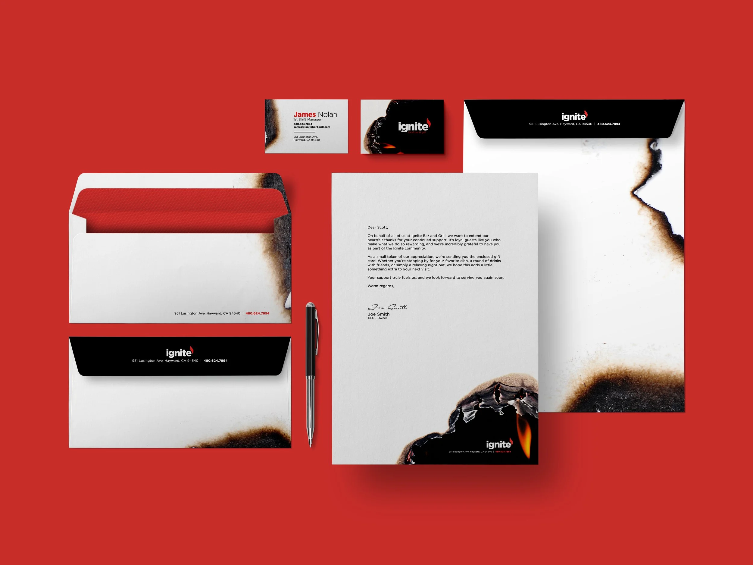 A red background with various Ignite Bar and Grill branding materials, including business cards, a letter, envelopes, a pen, and promotional graphics featuring burnt edges and fire imagery.