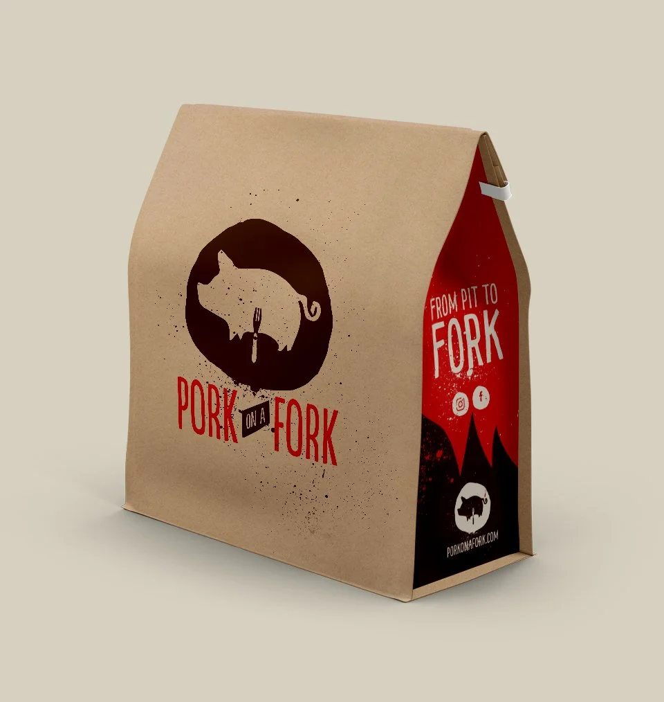 A brown paper takeout box with a graphic of a pig's head and the text "Pork on a Fork" in red and black, featuring a fork as part of the design.