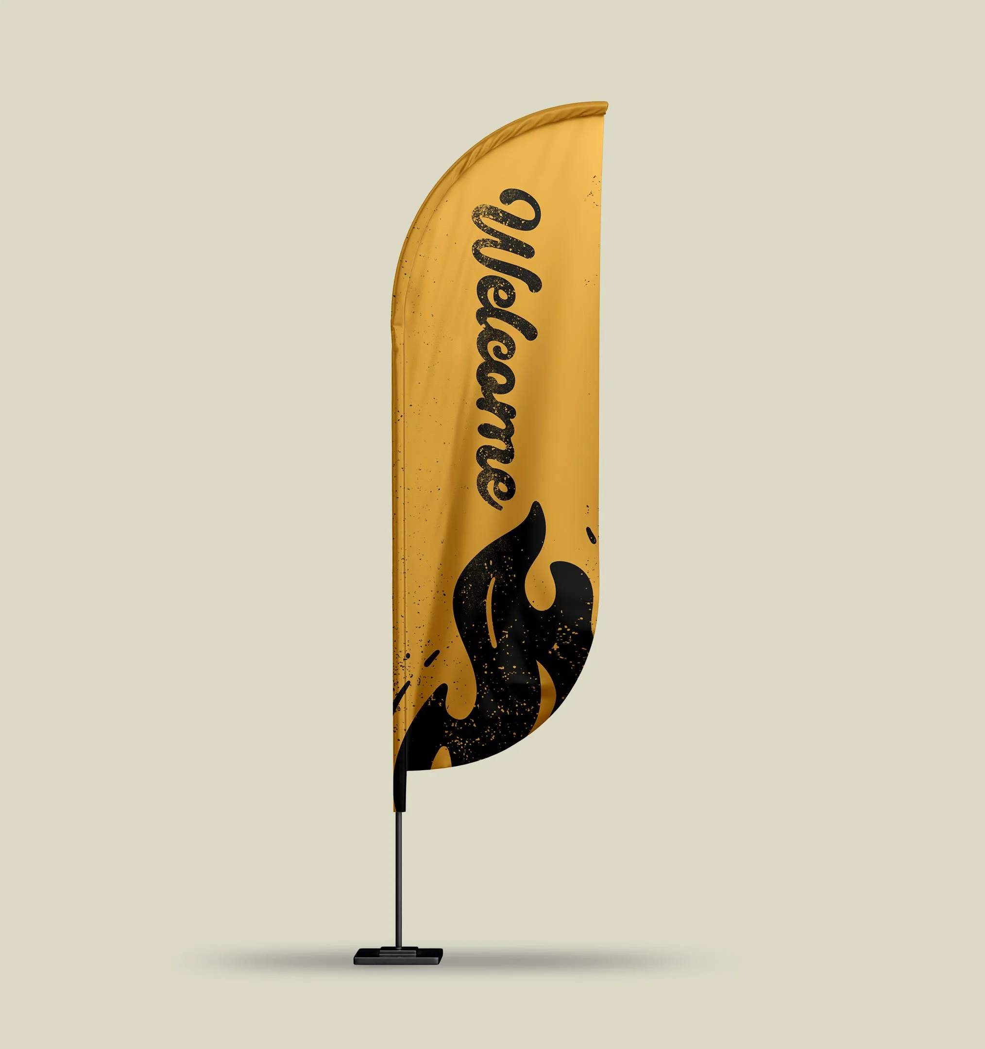 Close-up of a yellow beach flag with black splatter patterns and partially visible black text, mounted on a black pole against a plain light background.