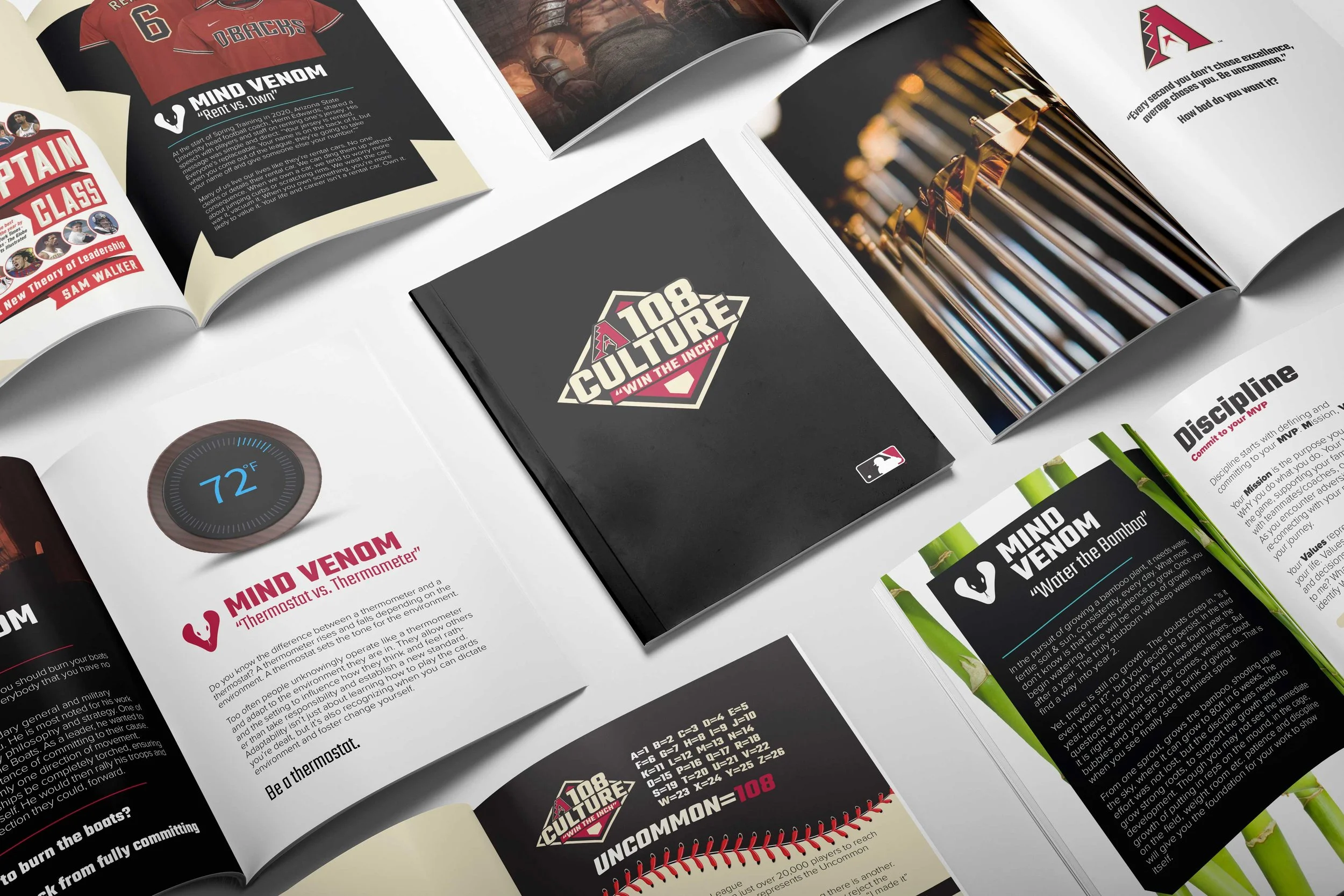 Open magazines displaying sports and motivational content, including images of uniformed athletes, a close-up of metal baseball bats, and infographics about baseball stats and virtues.