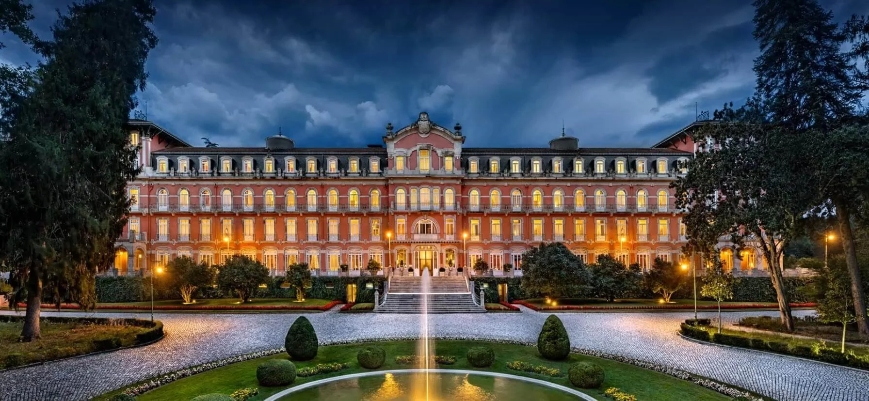 Vidago Palace Hotel wedding venue in Portugal with parkland gardens and elegant ceremony areas