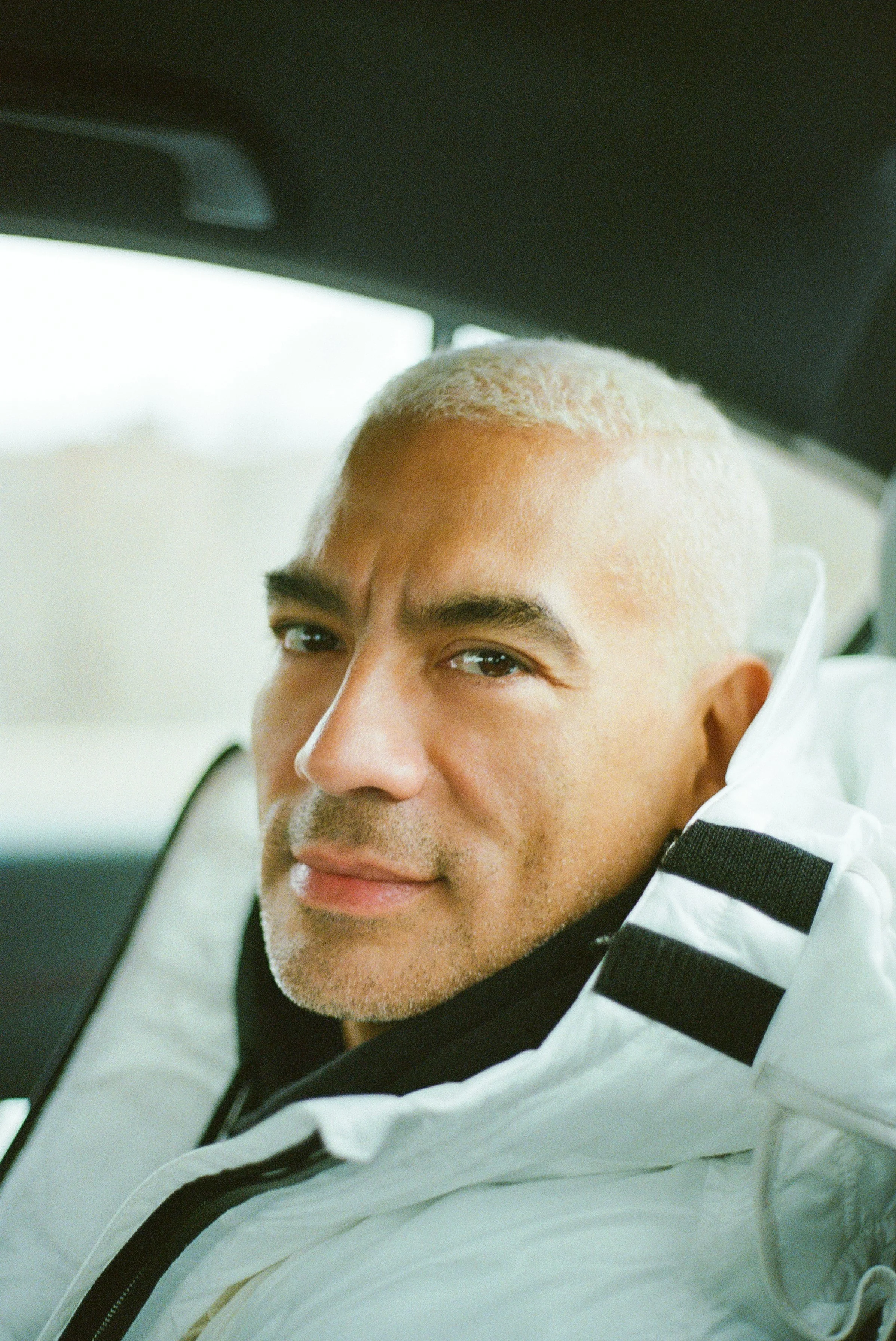 lifestyle photography. personal photographer following artist and fashion personality documenting the life of a fashion stylist, owner, director of luxury fashion. mens fashion photographer. mens portrait photography. travel photography