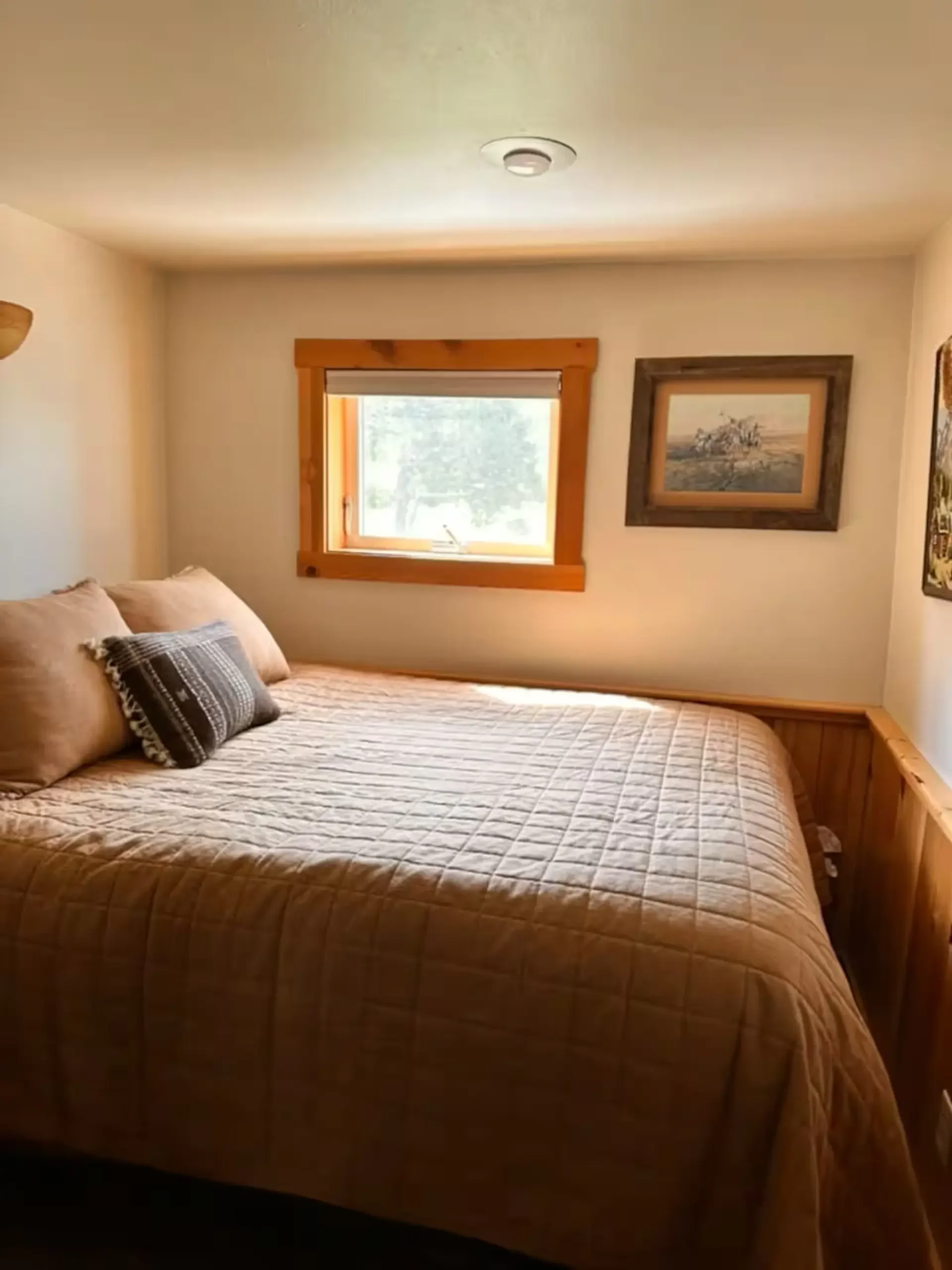 Tague's Place Bedroom with large bed.webp