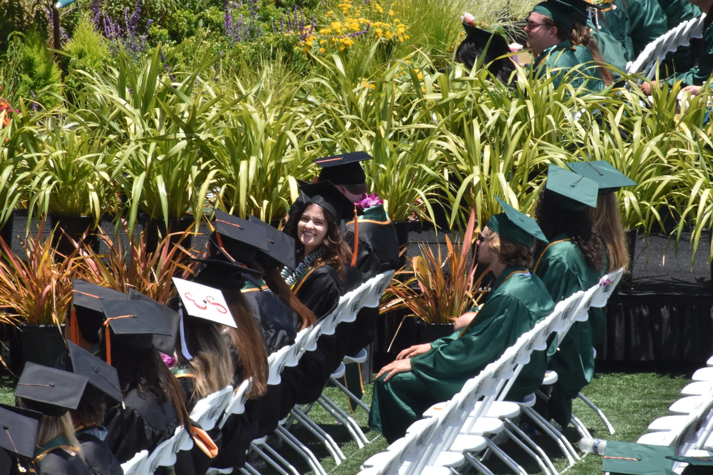 My sister sitting amongst her peers at Cal Poly's graduation about to receive her Masters Degree in Architectural Engineering.