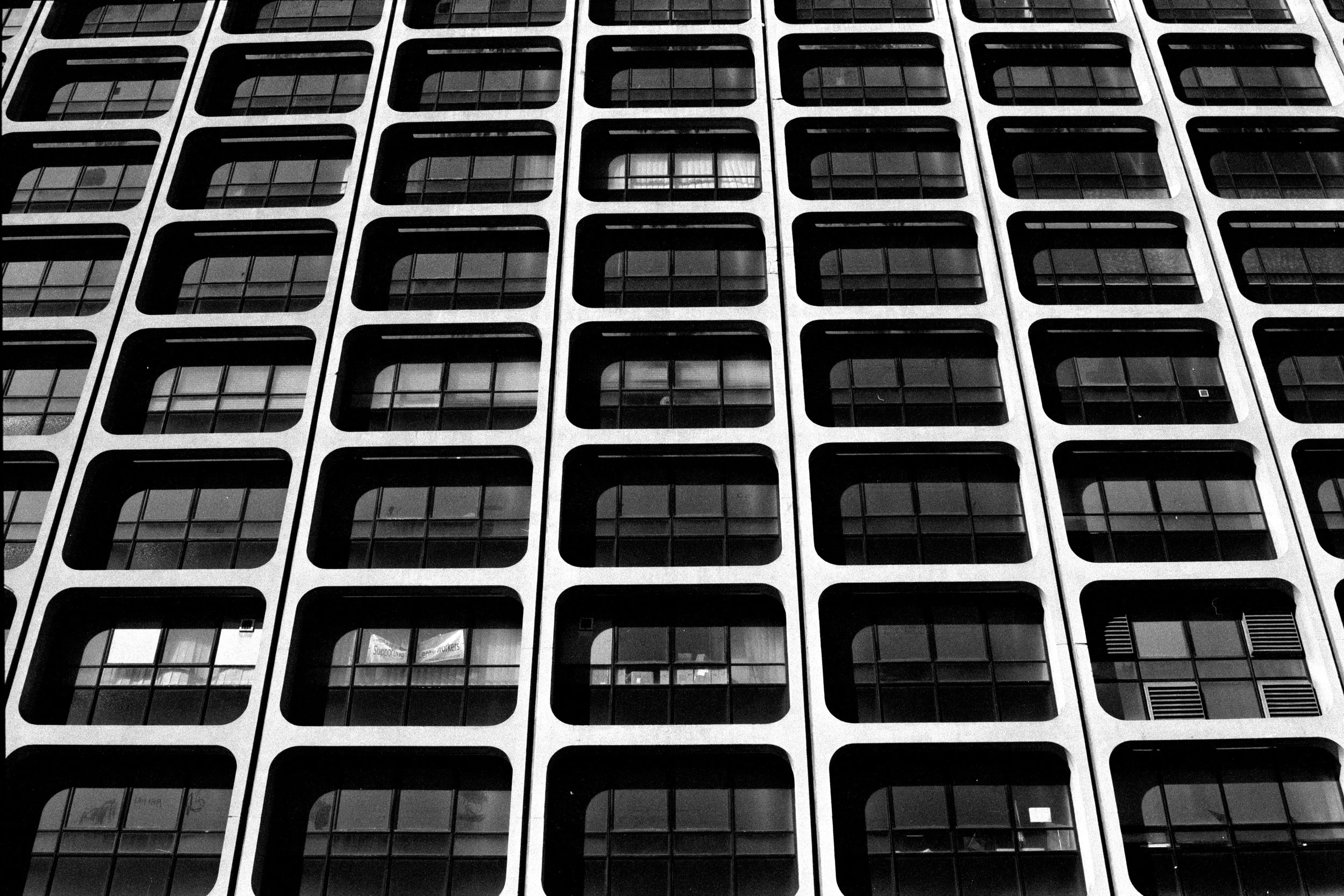 newcastle-upon-tyne-brutalist-facade-repeating-windows-detail-black-and-white-35mm-film.jpg