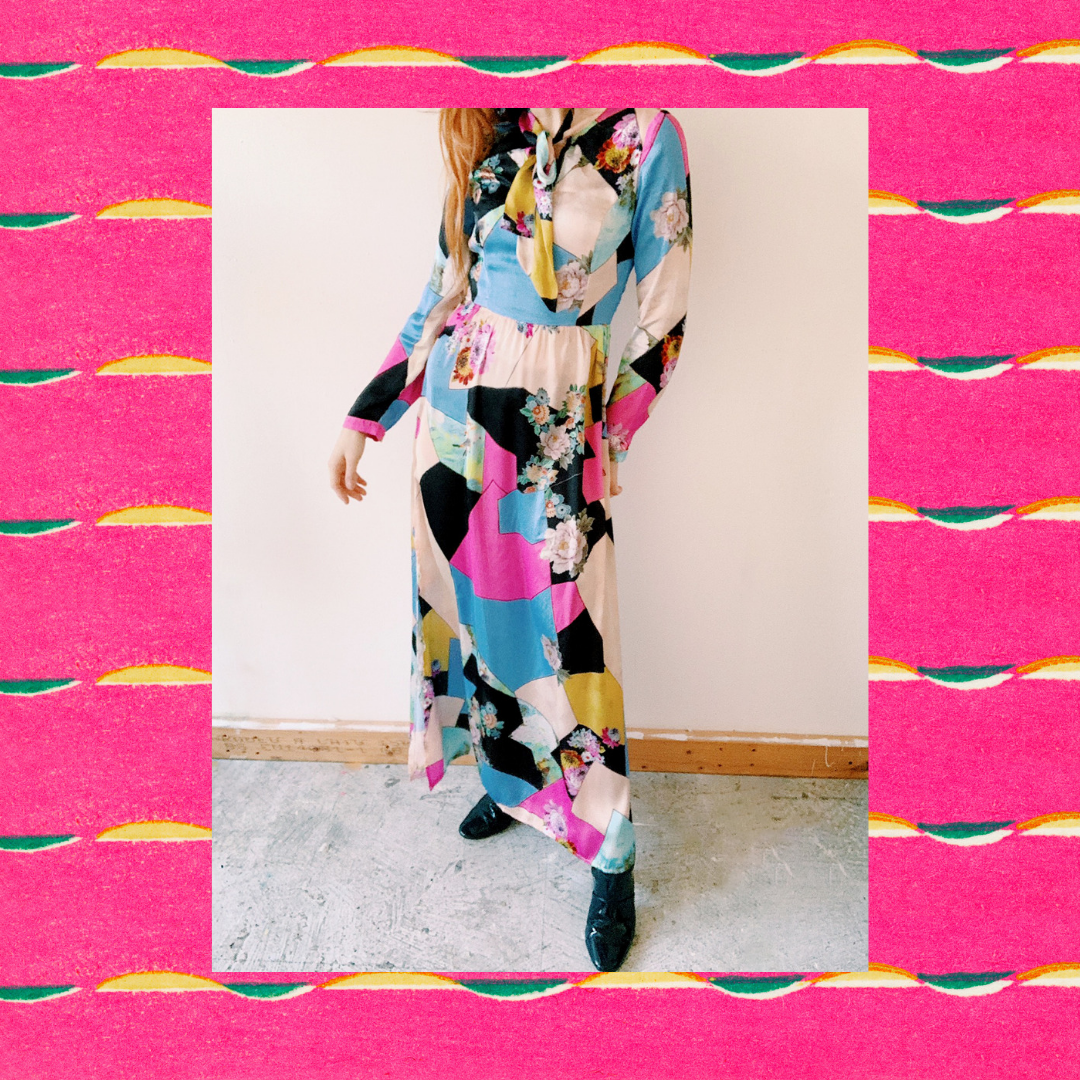Model wearing a bold patchwork vintage maxi dress in a colorful photo frame, styled by Louisa Rogers.