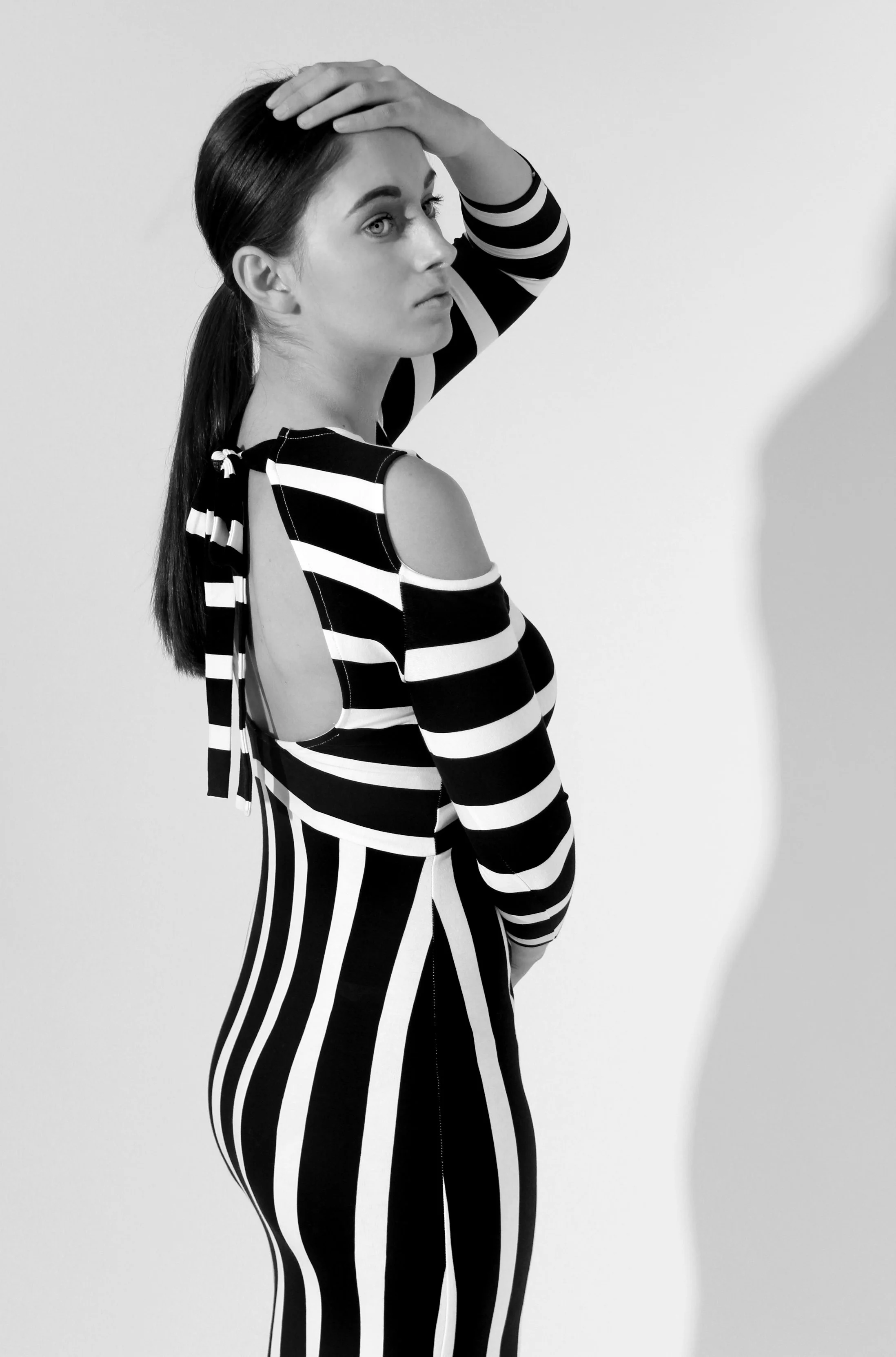 black-white-stripe-catsuit-cold-shoulder-profile-studio-fashion-editorial-photography.jpg.JPG