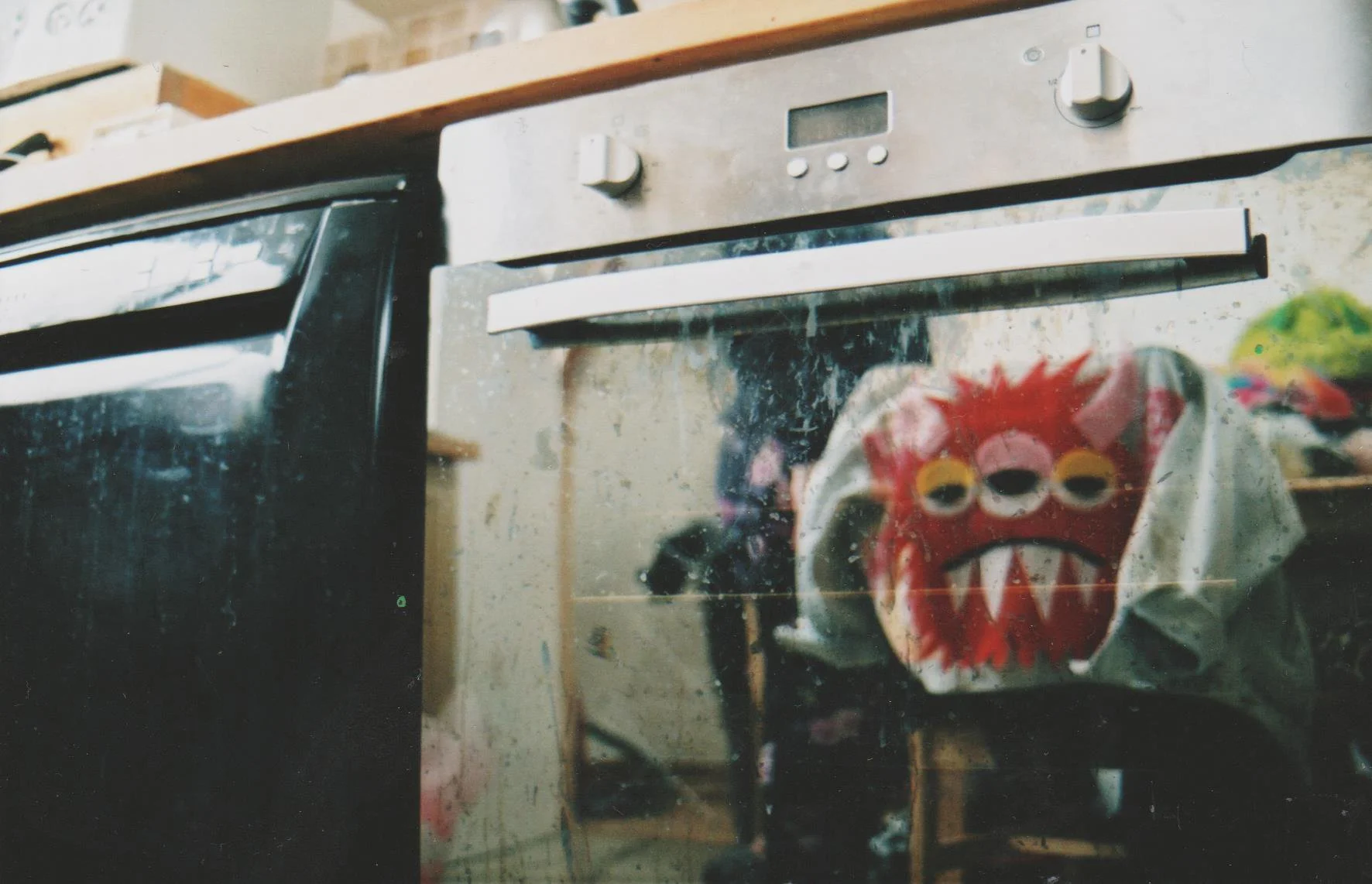 funky-monster-jacket-reflection-oven-door-35mm-film-kitchen-photography.jpg.jpg