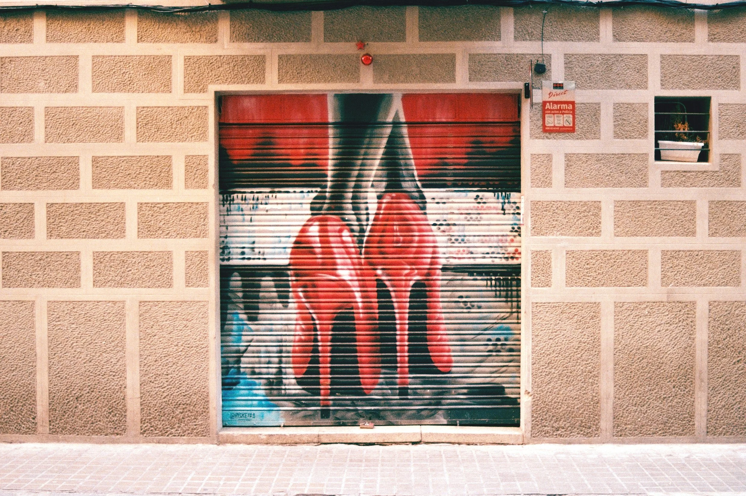 barcelona-street-art-stiletto-heel-graffiti-shop-shutter-35mm-film.jpg.jpg
