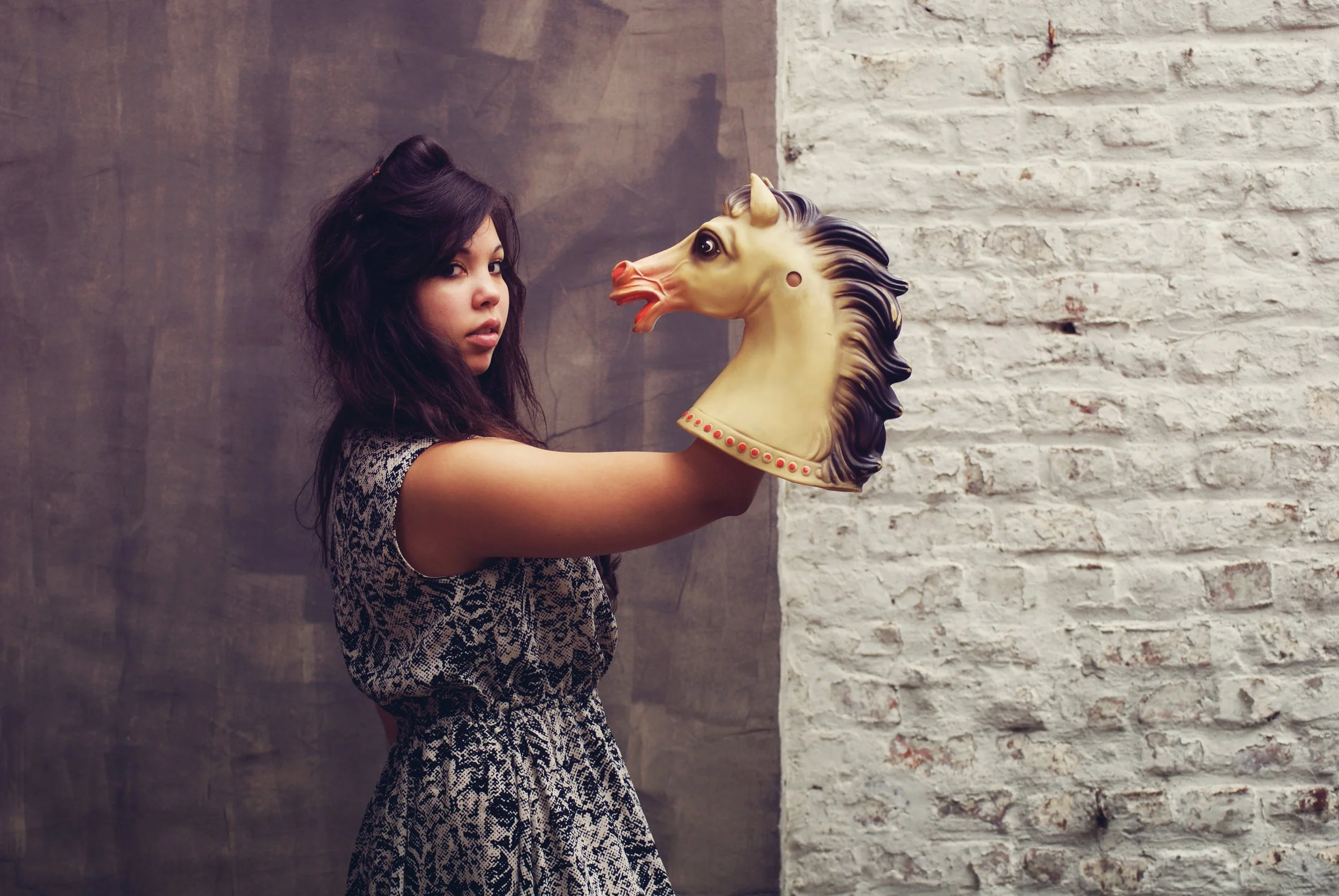 surreal-portrait-woman-holding-vintage-horse-head-prop.jpg.jpg