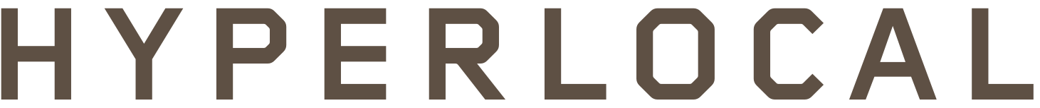 Close-up image with the word "HYPERLOCAL" in large, bold, black letters on a tan background.