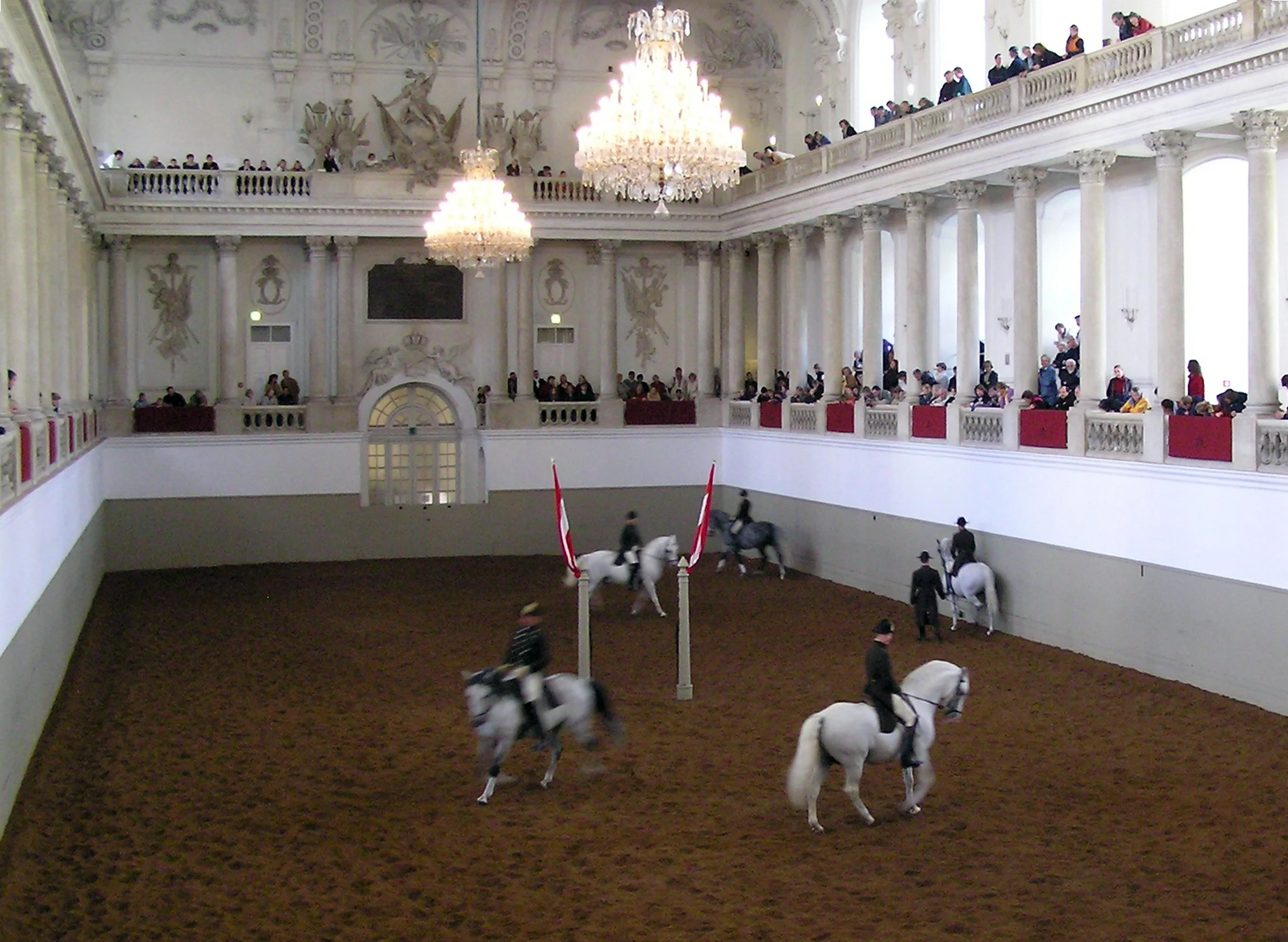 A close-up view of a vintage Toyota Land Cruiser vehicle with a sticker that says 'HYPER LOCAL' on its door, parked outdoors with trees and sky in the background.