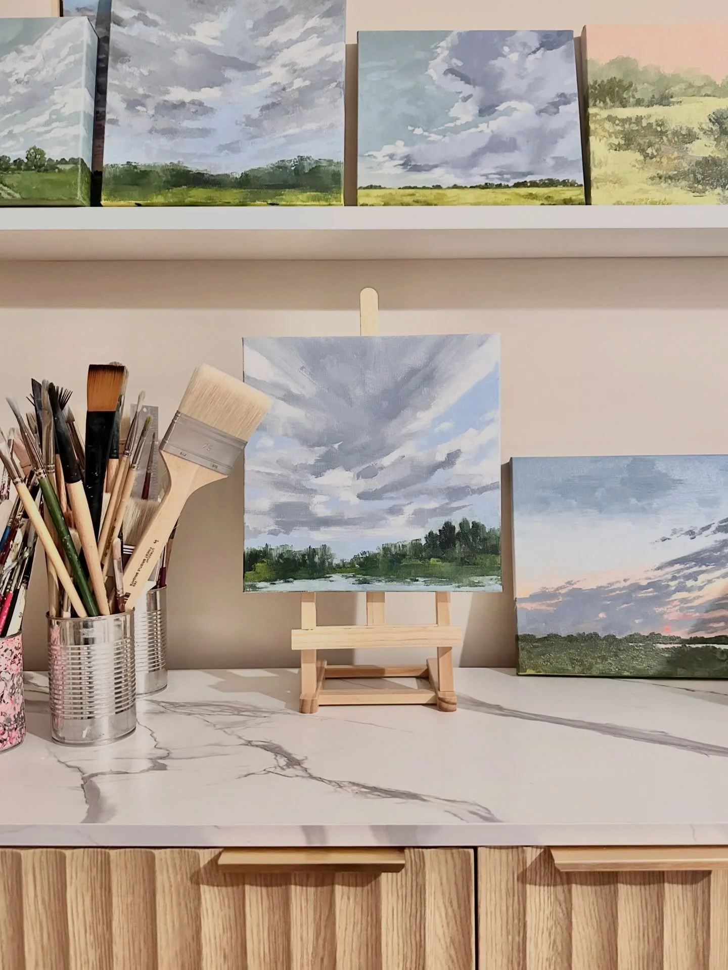 Here's a peek into a corner of my studio. I finished this painting on the mini easel last week, just before I caught the flu! I spent two days in bed with a fever, but I'm finally starting to recover and can't wait to get back to painting. 

#landsca