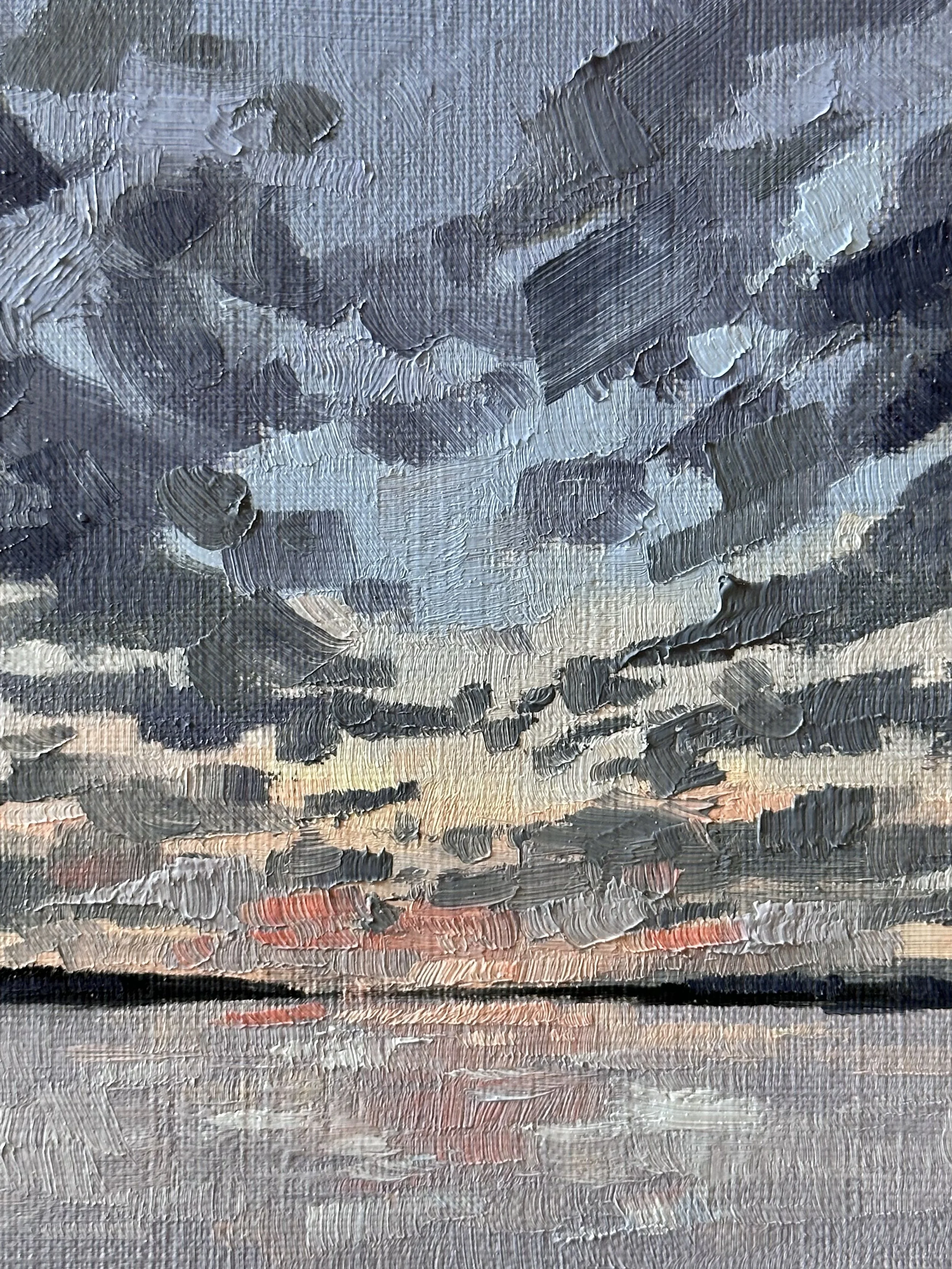 Oil painting of a sunset over a body of water, with dark clouds in the sky and warm colors near the horizon by Elizabeth Atlas.