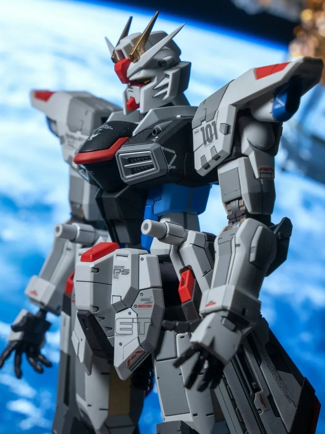 Close-up of the Gundam RX-78-2 toy robot with a space background.