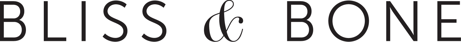 Stylized logo with the text 'Bliss & Bone' in black, minimalistic font on a transparent background.