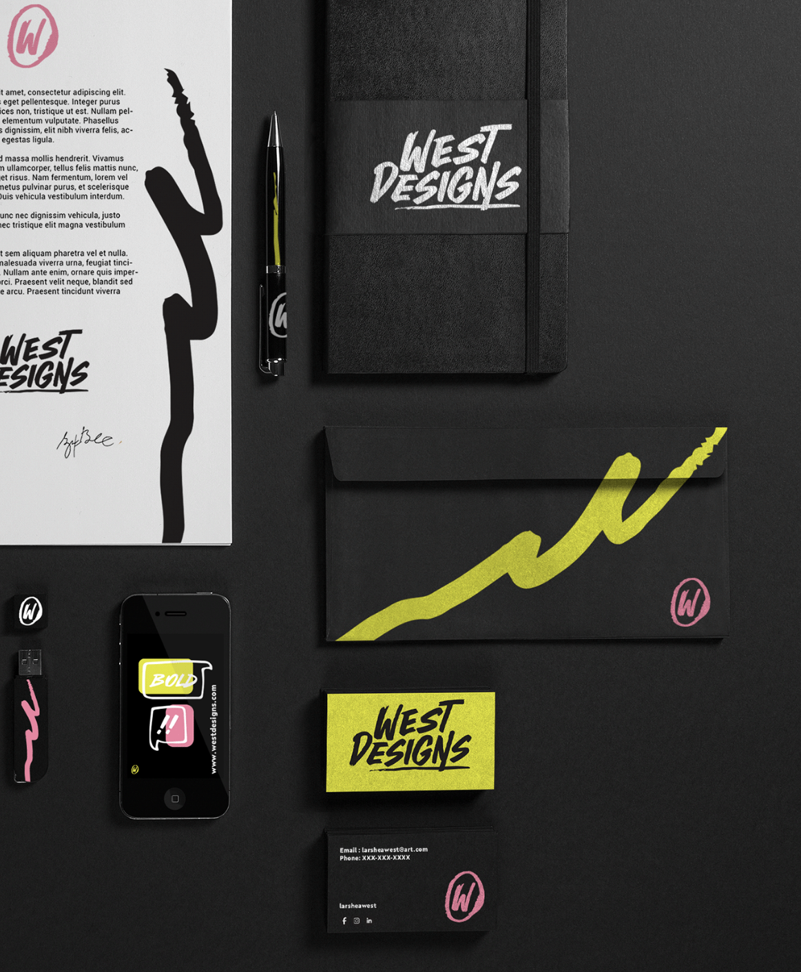 Flat lay of branding and marketing materials for West Designs, including a black notebook, business cards, a pen, a smartphone displaying the West Designs logo, a folder, a letter with a handwritten signature, and various stickers and paper with the West Designs logo and branding in black, yellow, and pink colors.
