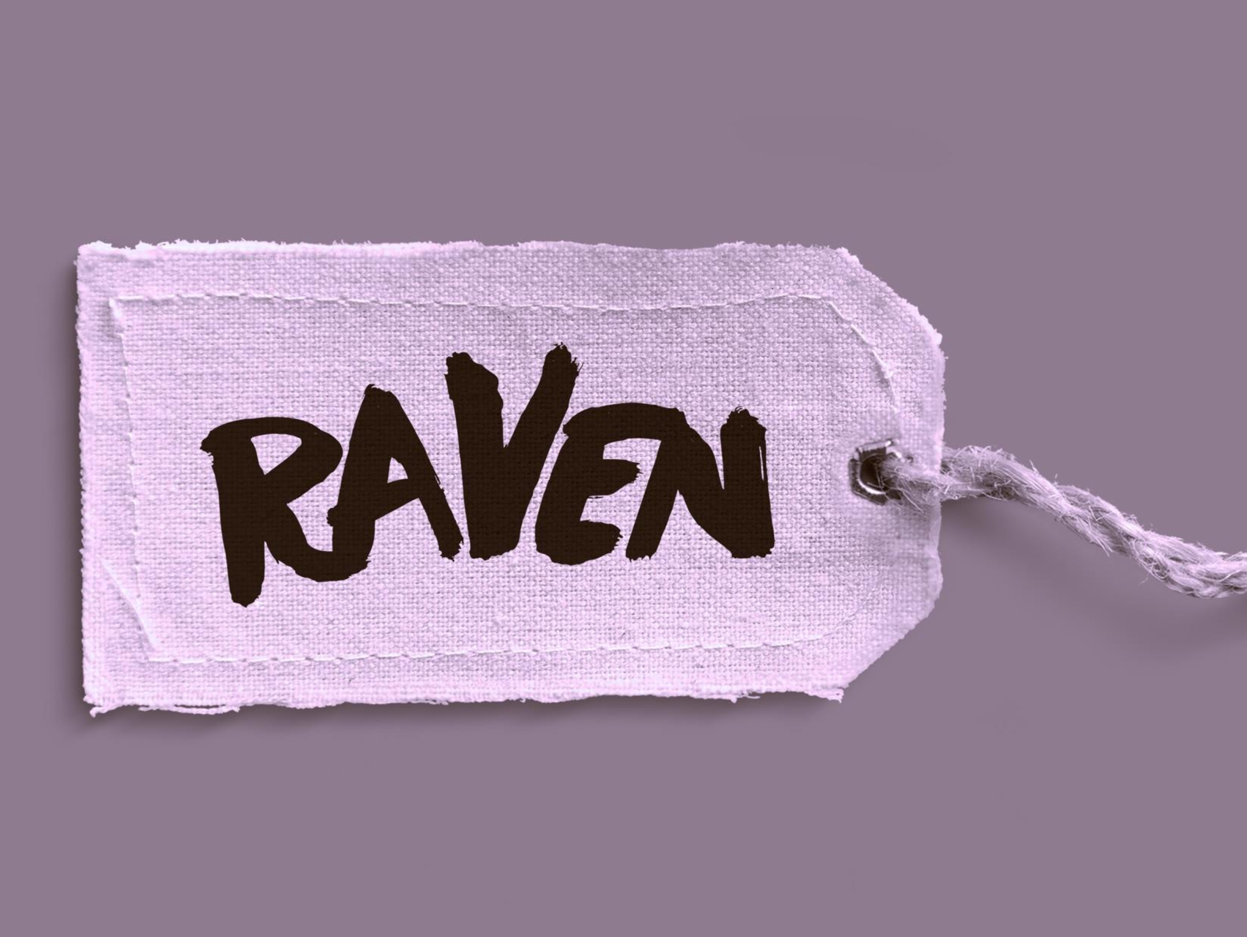 A small pink fabric pouch with the word 'Raven' written on it in black letters and a drawstring closure.