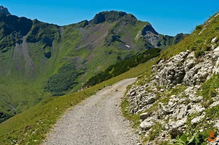 An old, weathered, printed topographical map with various lines, markings, and labels depicting terrain, roads, and geographical features.
