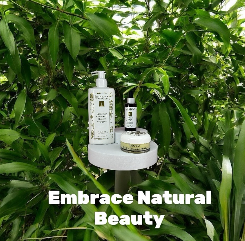 Skincare products displayed on a white stand, surrounded by green leaves with the caption "Embrace Natural Beauty."