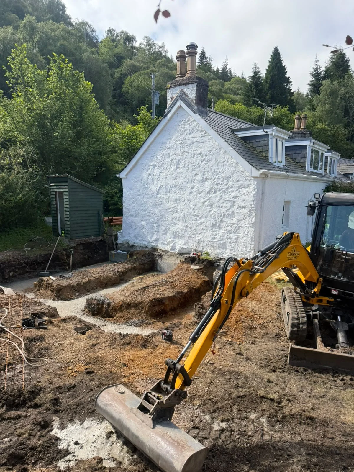Digger carrying out building work